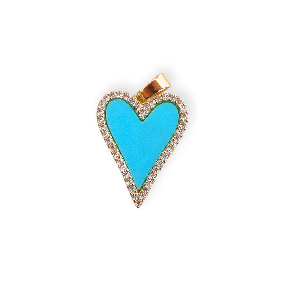 Dije de corazón de chapa de oro con borde de zirconias y esmalte azul sobre fondo blanco