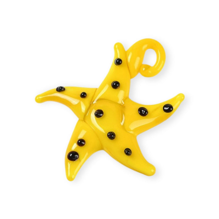 Dije artesanal de murano amarillo en forma de estrella de mar con puntos negros