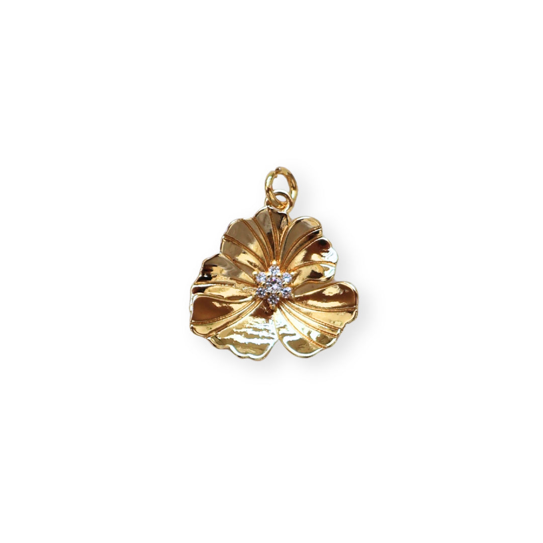 Dije flor dorada en chapa de oro con zirconia en el centro
