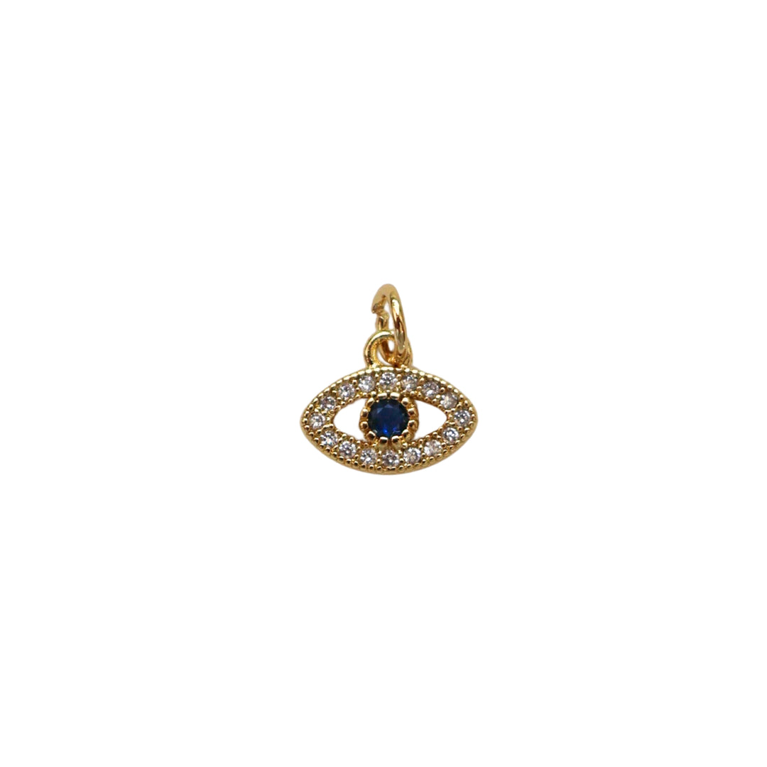 Dije dorado en forma de ojo con zirconias y centro azul oscuro