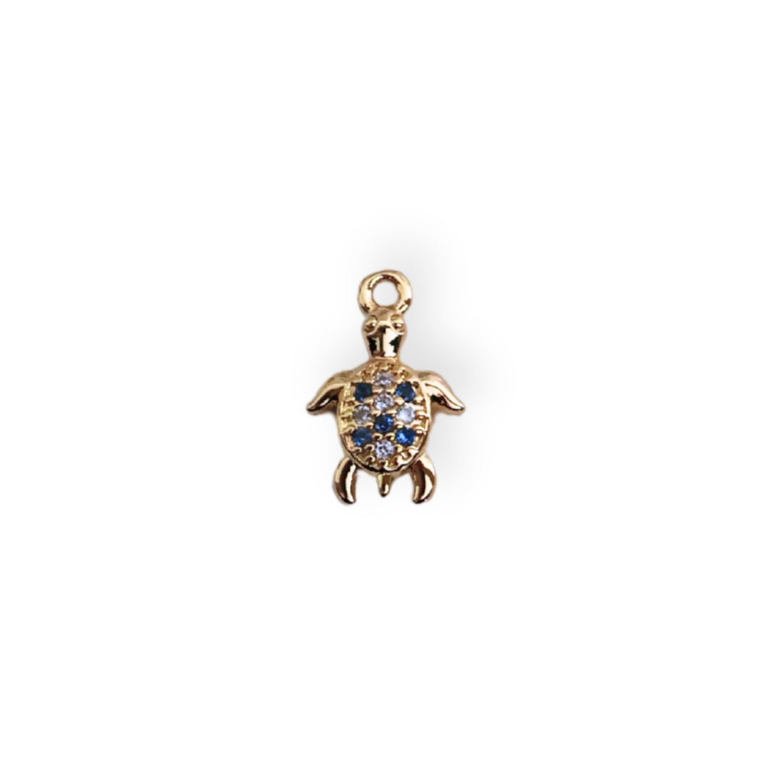 Dije tortuga en chapa de oro con zirconia brillante