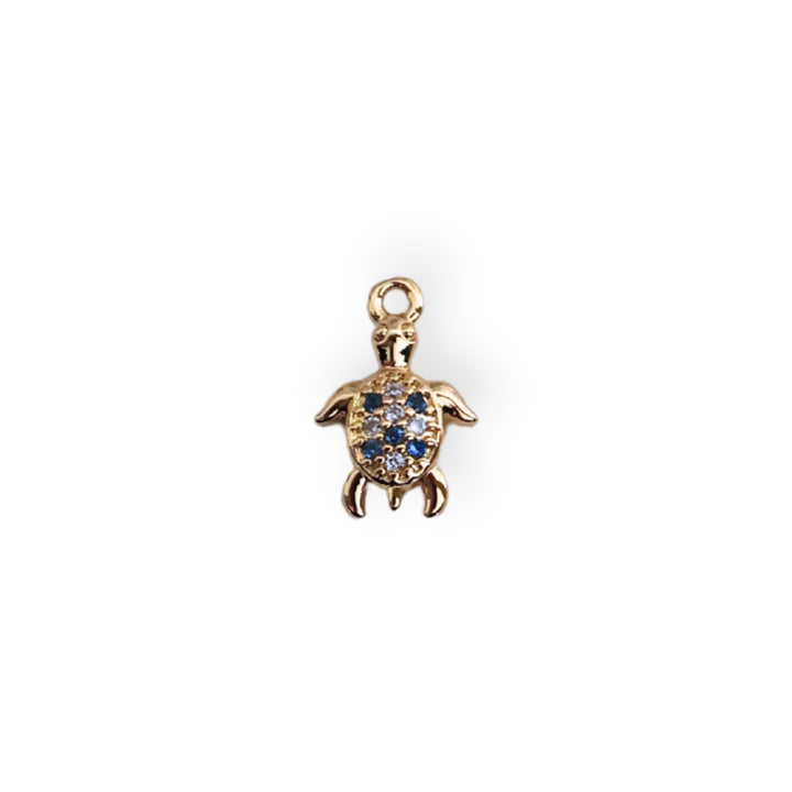 Dije tortuga en chapa de oro con zirconia brillante