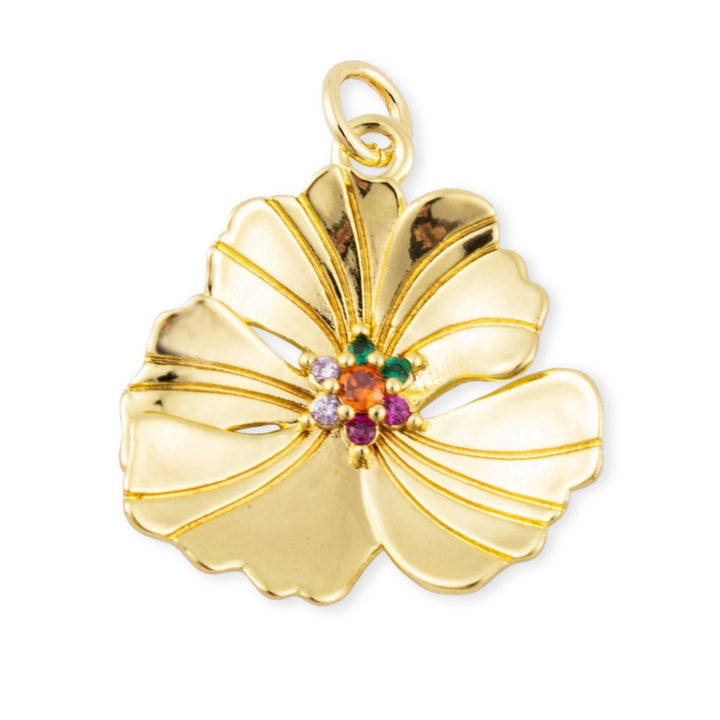 Dije en forma de flor dorada con zirconias multicolor en el centro