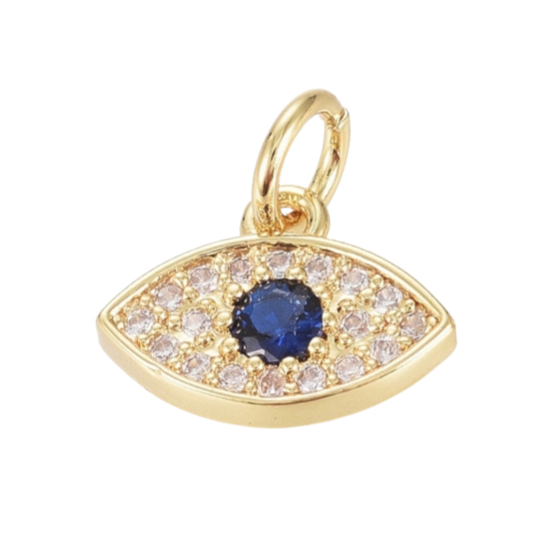 Dije en forma de ojo dorado en chapa de oro con zirconia al centro