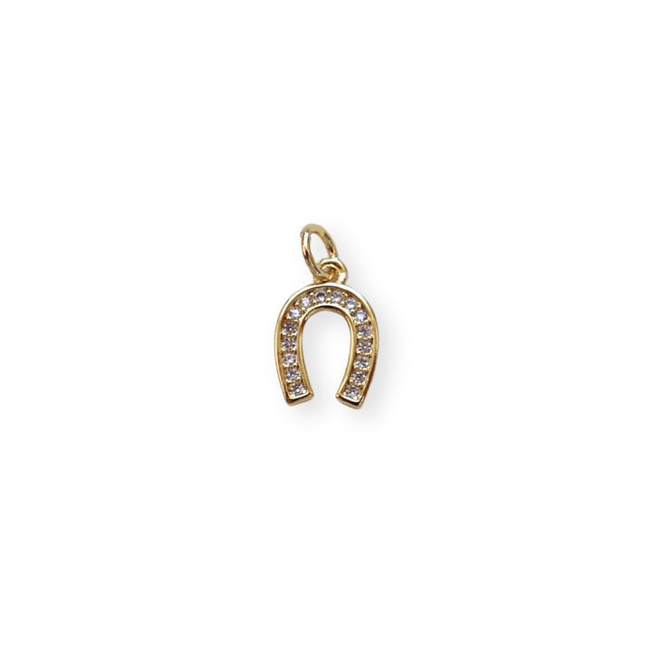 Dije dorado en forma de herradura de caballo con zirconias