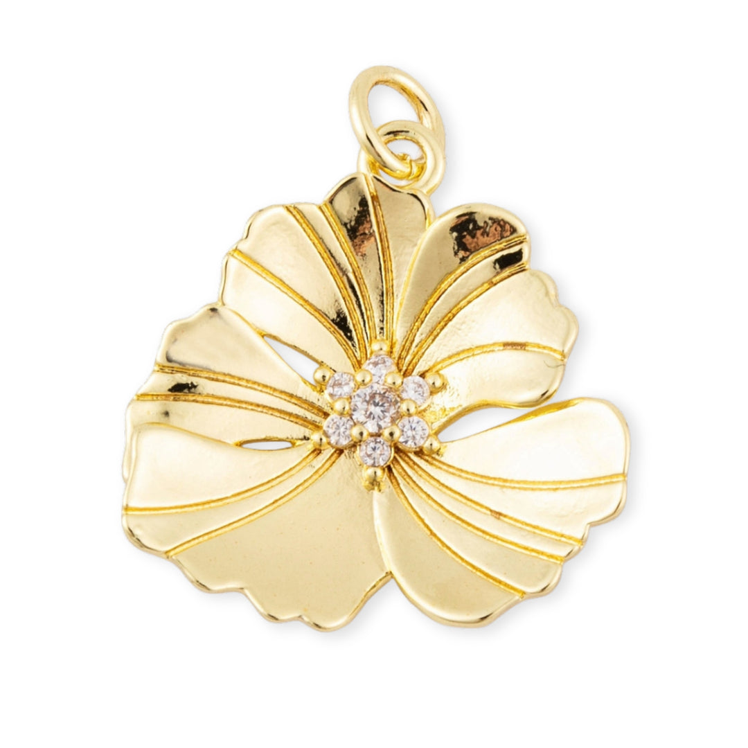 Dije flor dorada en chapa de oro con zirconia en el centro