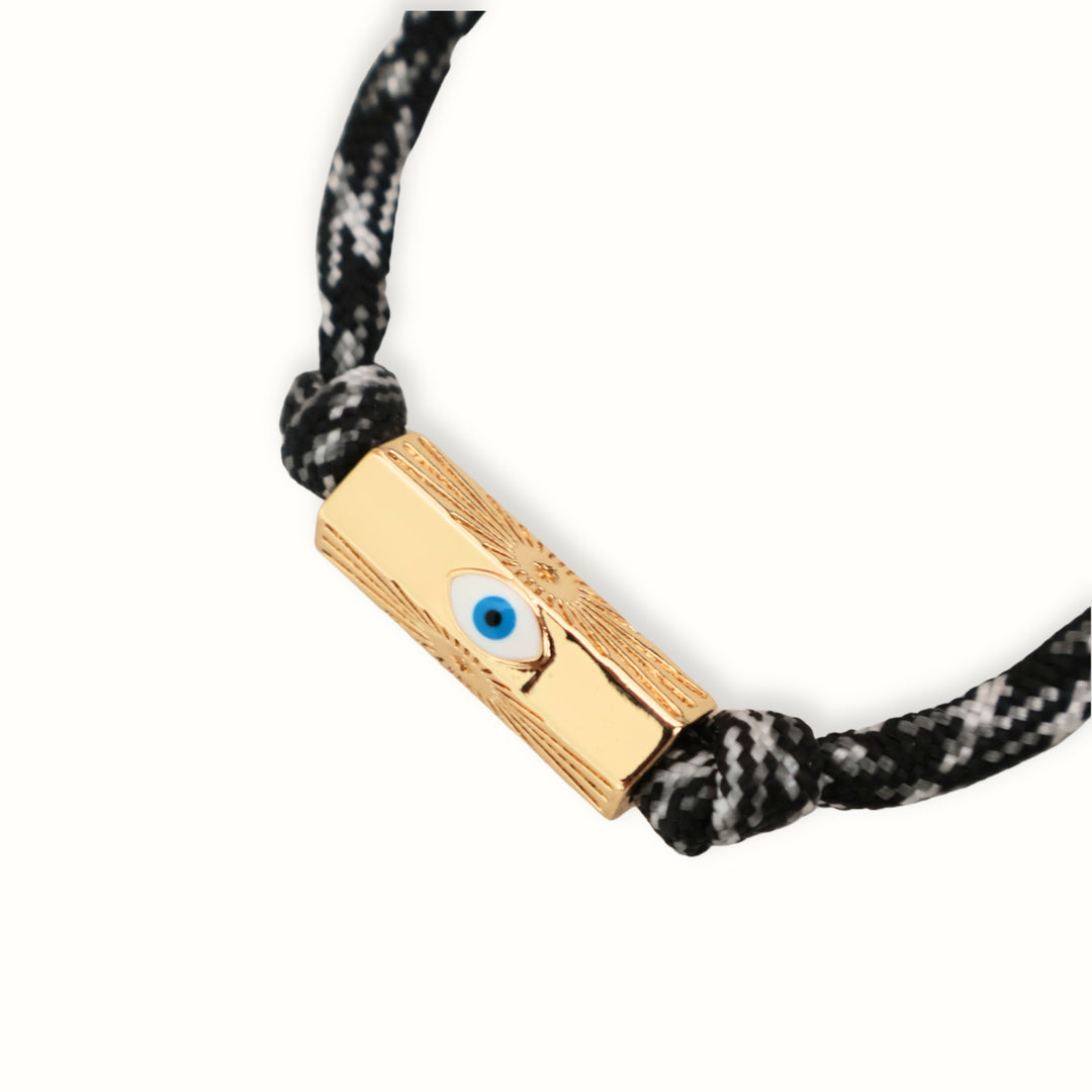 Pulsera Elvira con separador esmaltado dorado sobre cordón paracord