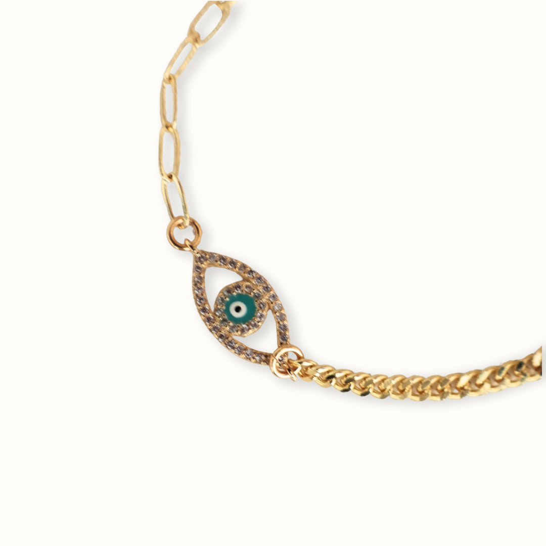 Brazalete Luriah con dije de ojo en chapa de oro y zirconia