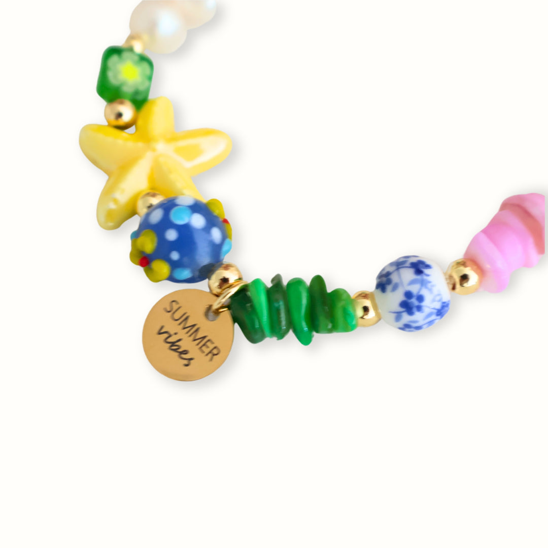 Brazalete Kaona con perla de río, tortuga verde y estrella de mar