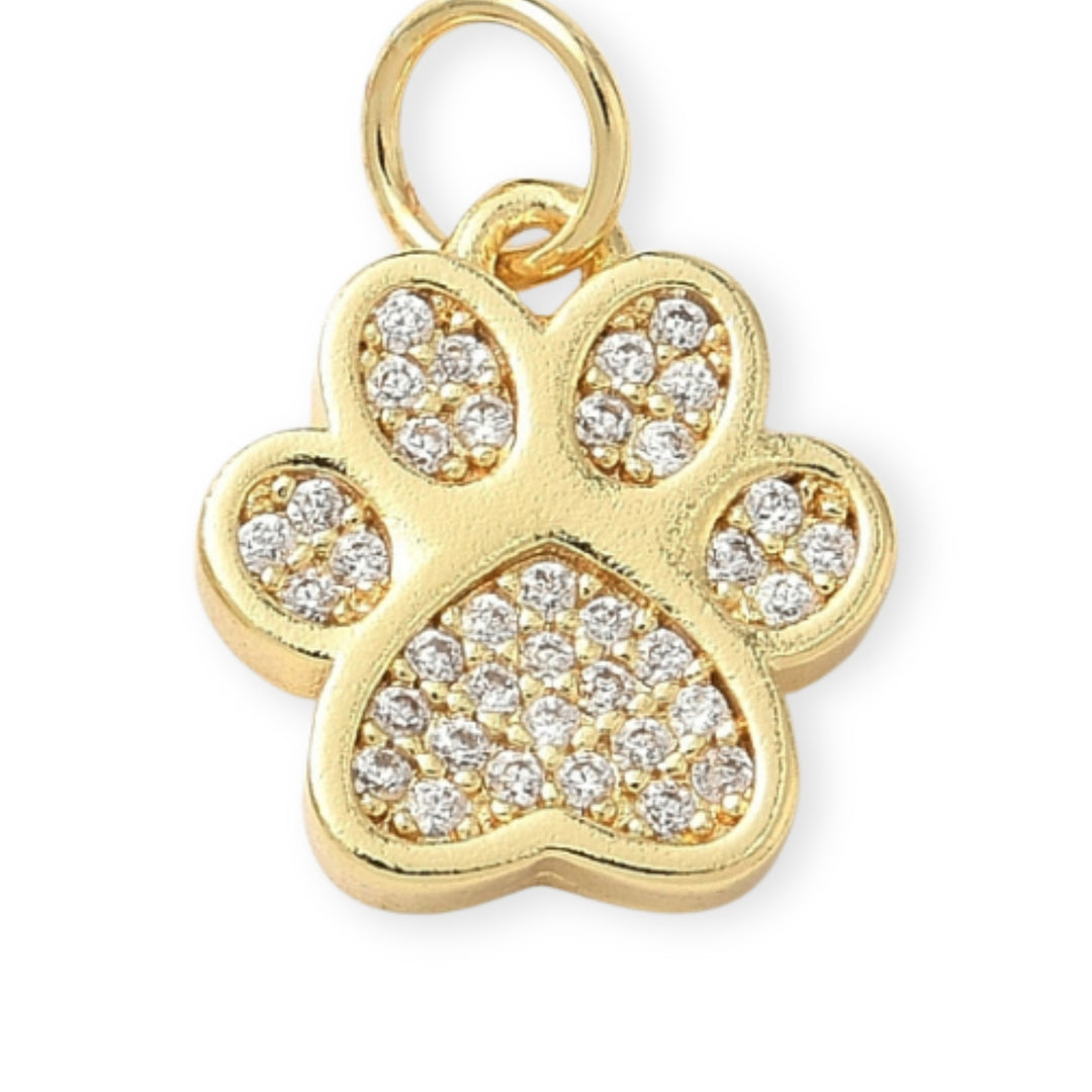 Dije huella de perro dorada con zirconia brillante