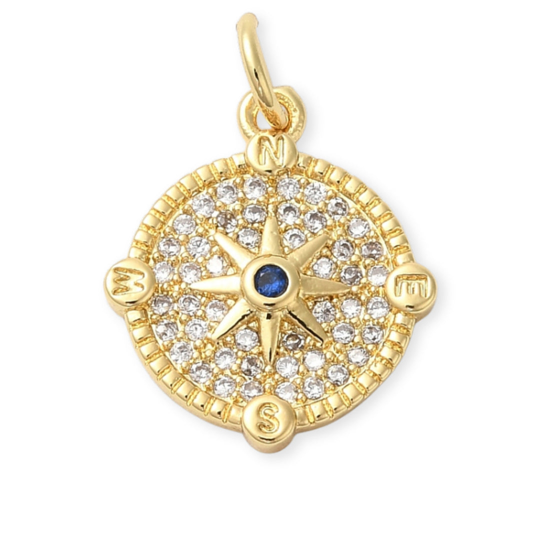 Dije circular dorado con estrella al centro y zirconia