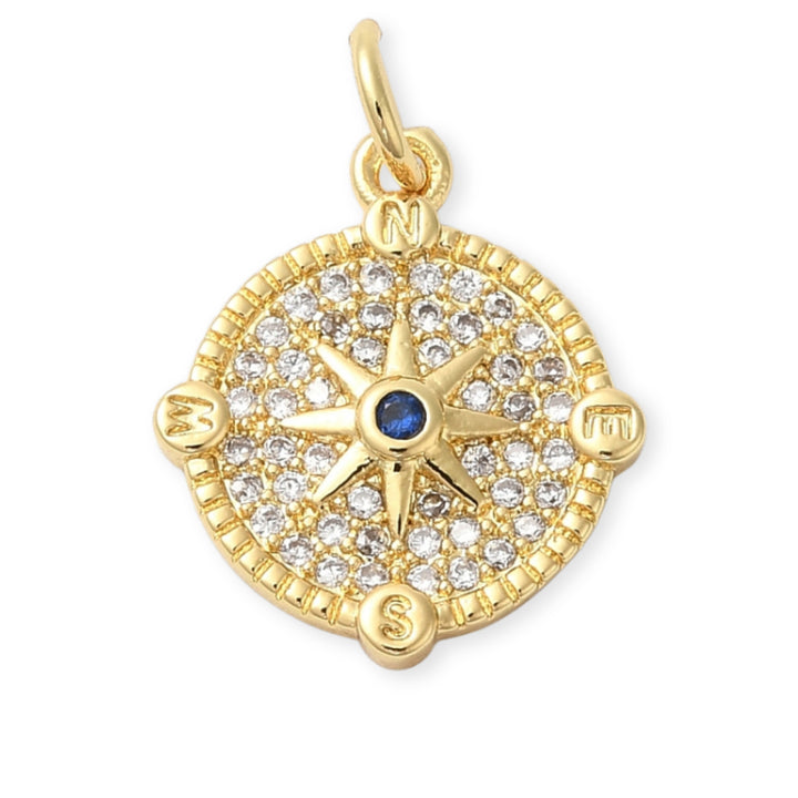 Dije circular dorado con estrella al centro y zirconia