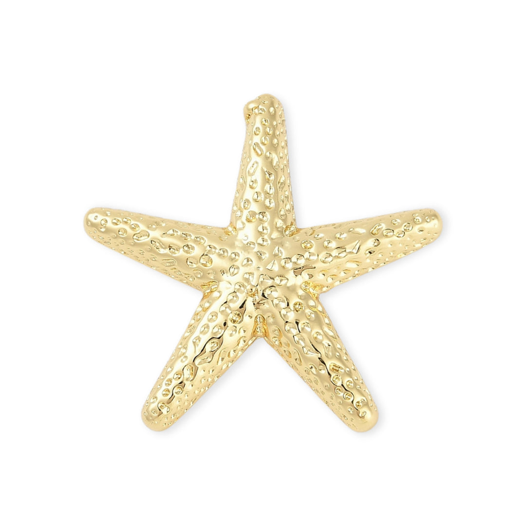 Dije estrella de mar dorada en chapa de oro con ojal trasero