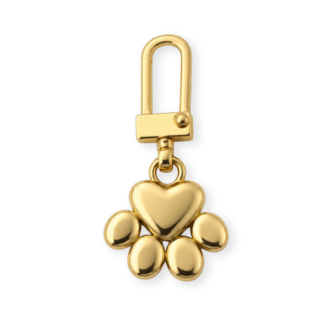 Dije en forma de huella de perro con acabado de chapa de oro