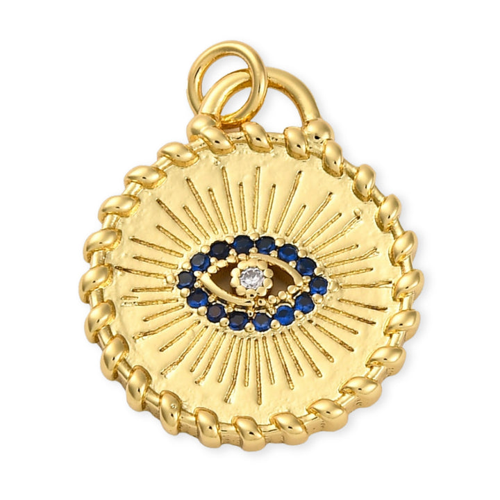 Dije circular dorado con ojo turco y zirconias en chapa de oro