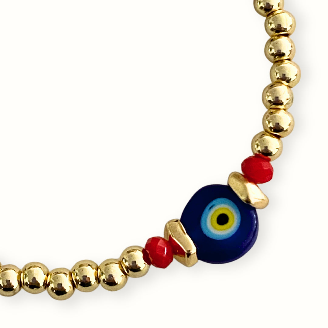 Pulsera elástica con ojo turco de murano y cristal facetado.