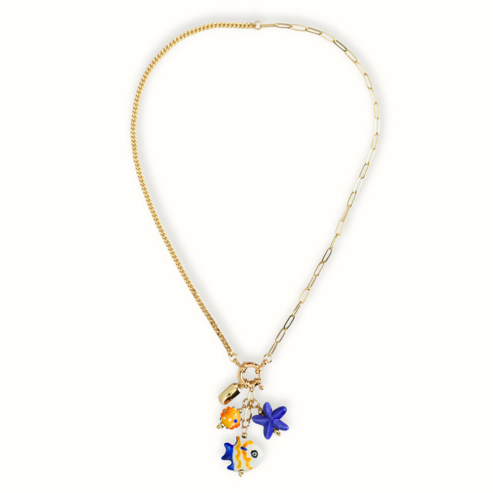 Collar de chapa de oro con estrella azul y piedra naranja