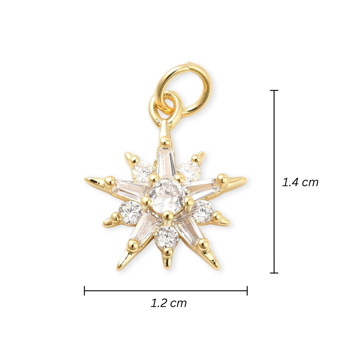 Medidas para Dije estrella dorado con zirconia en el centro sobre fondo blanco