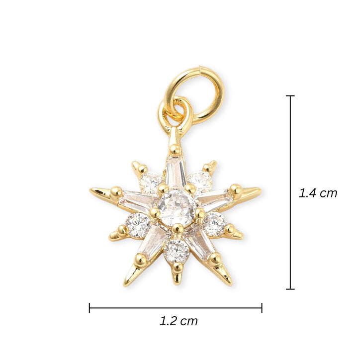 Medidas para Dije estrella dorado con zirconia en el centro sobre fondo blanco
