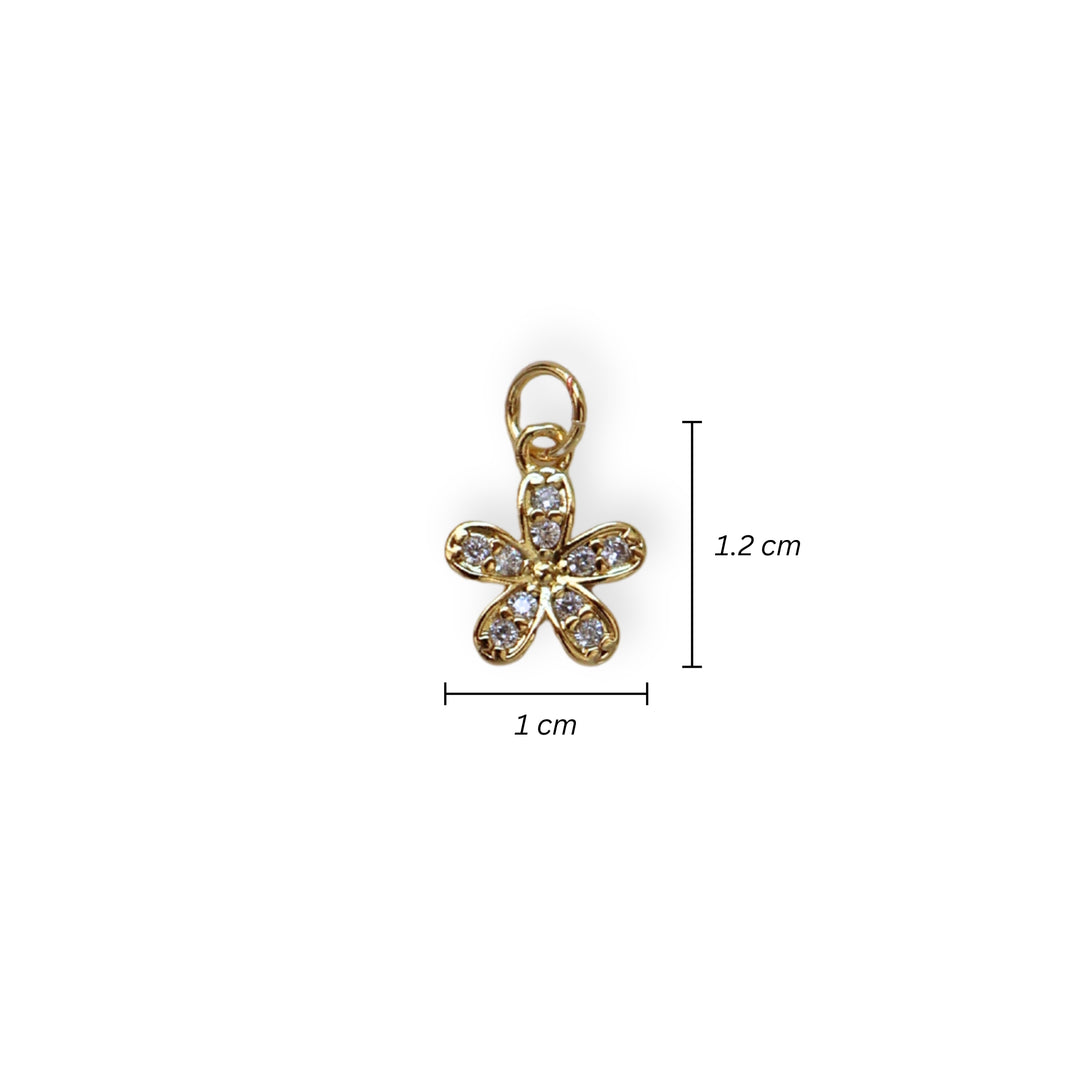Medidas para dije flor dorada en chapa de oro con zirconia en el centro