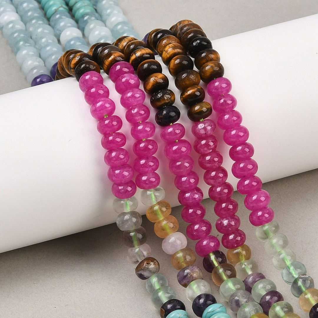 Tira de jade, ojo de tigre, fluorita y turquesa sintética en corte rondel de 6 mm