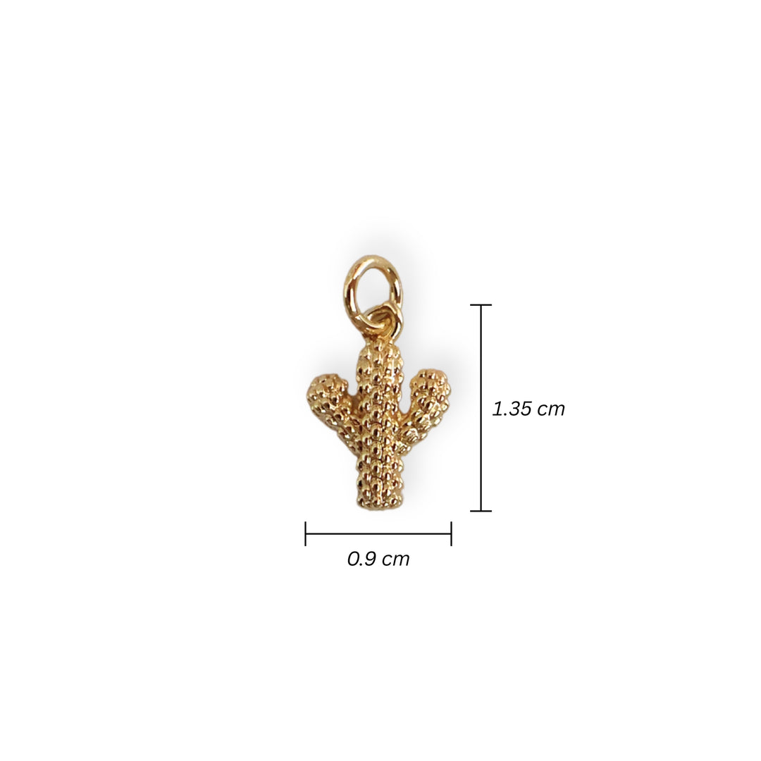 Medida para dije en forma de cactus de chapa de oro sobre fondo neutro