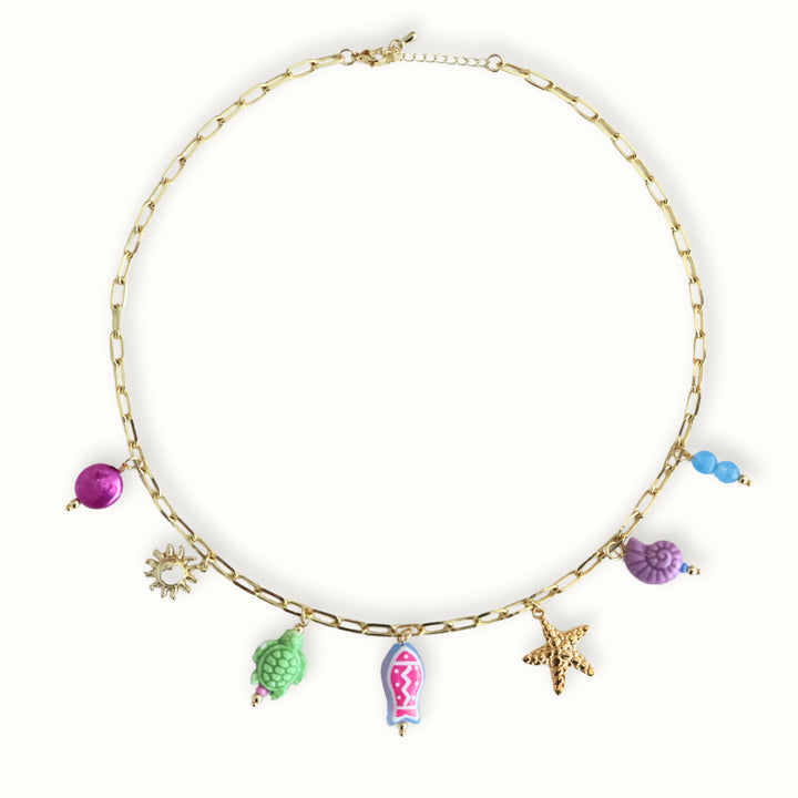 Collar con dije de sol, tortuga y estrella de mar Calypso
