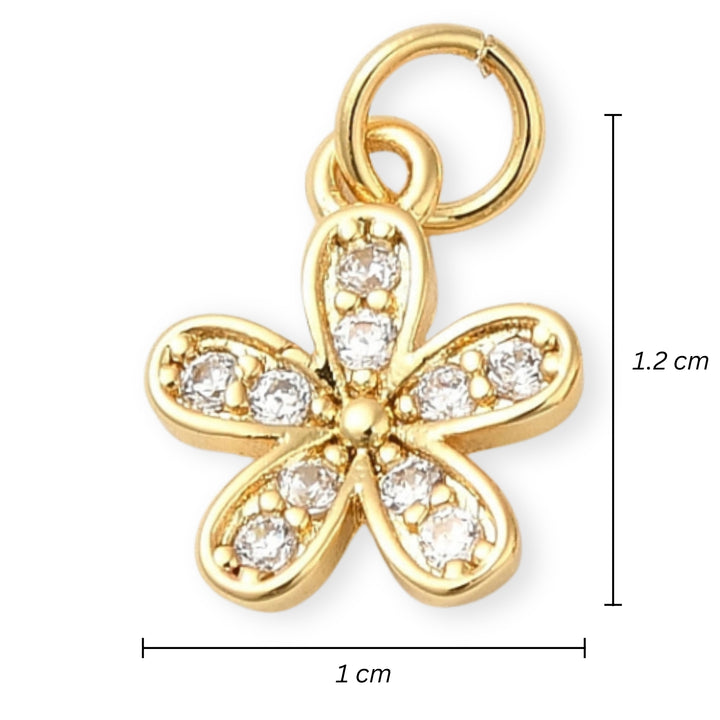 Medidas para Dije flor dorada en chapa de oro con zirconia en el centro