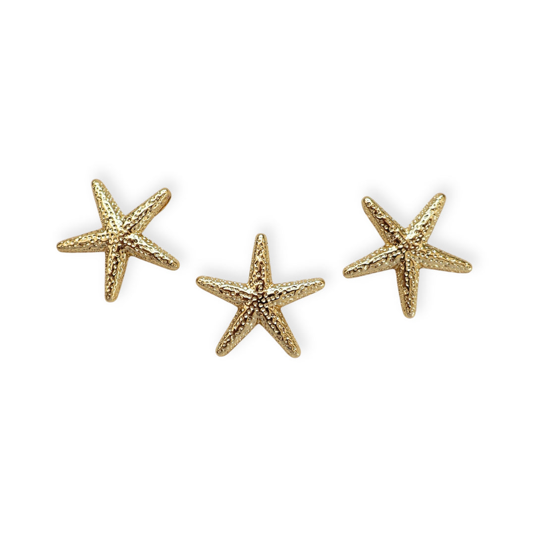 Detalles de dije estrella de mar dorada en chapa de oro con ojal trasero