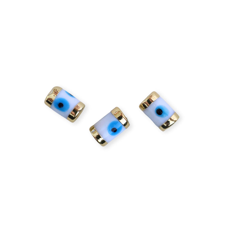 Detalles de separadores cilíndricos de murano con diseño de ojo y marco dorado