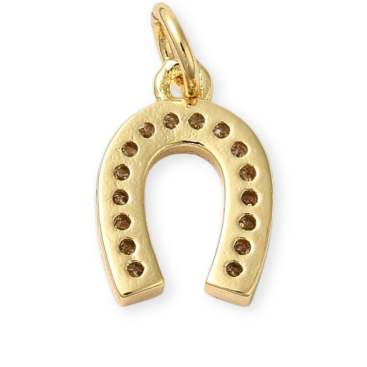 Detalles de Dije dorado en forma de herradura de caballo con zirconias