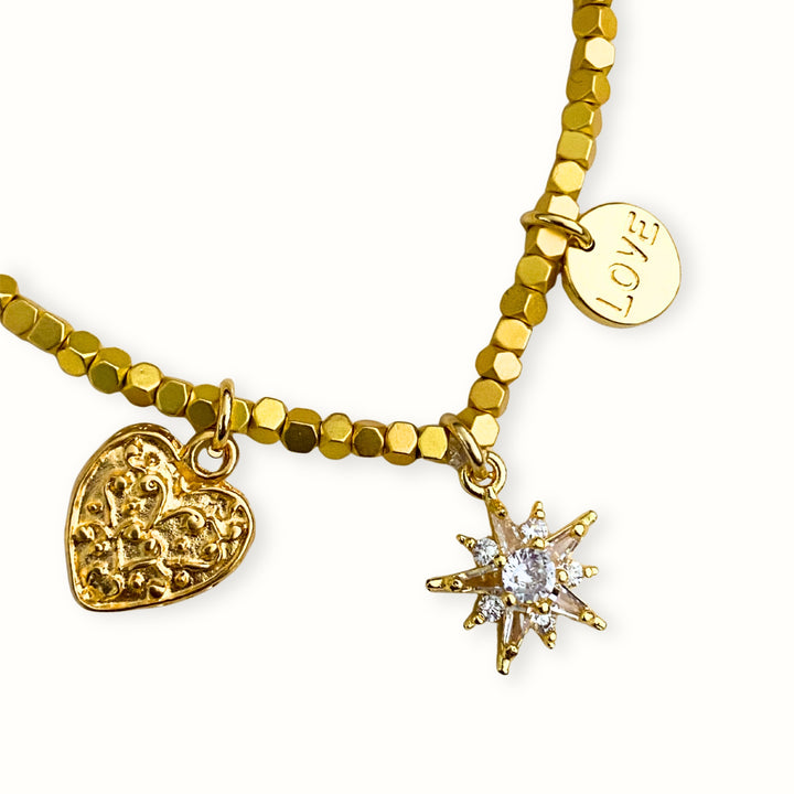 Detalles de Brazalete de hematita con dijes de corazón, estrella y Love de chapa de oro