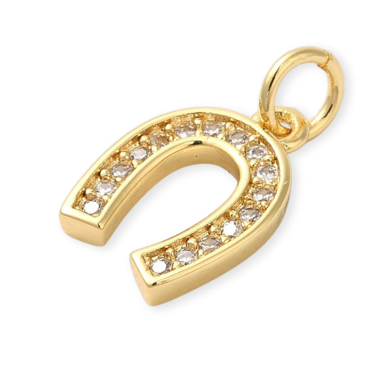 Detalles de Dije dorado en forma de herradura de caballo con zirconias
