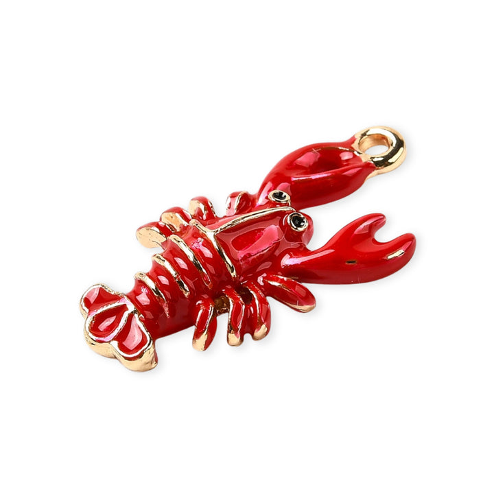Detalles de Dije de langosta de chapa de oro esmaltado en rojo sobre fondo blanco