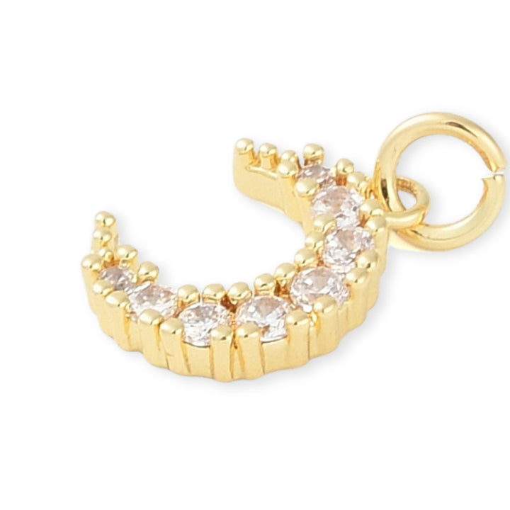 Detalles de Dije dorado en forma de luna con zirconia.