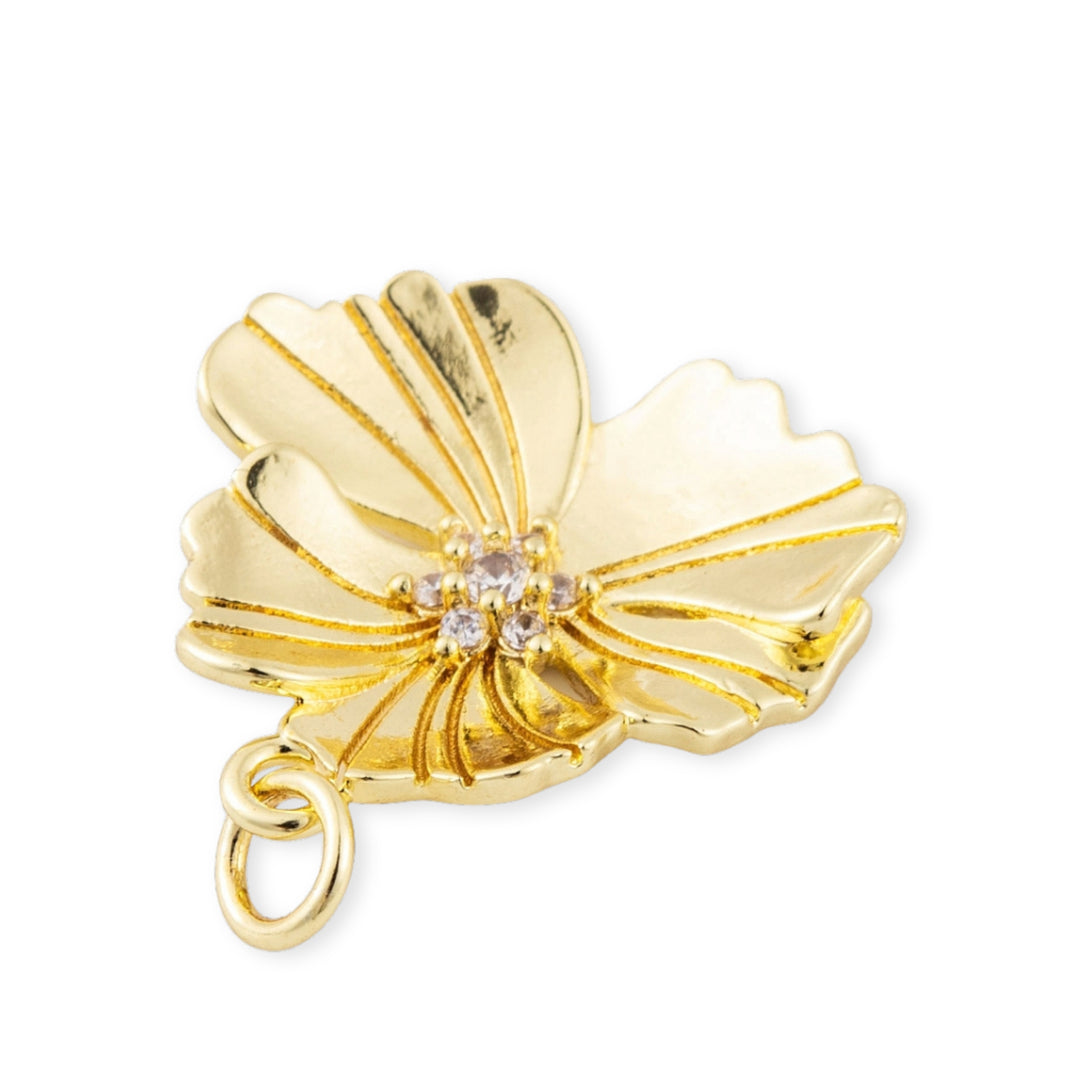 Detalles de Dije flor dorada en chapa de oro con zirconia en el centro