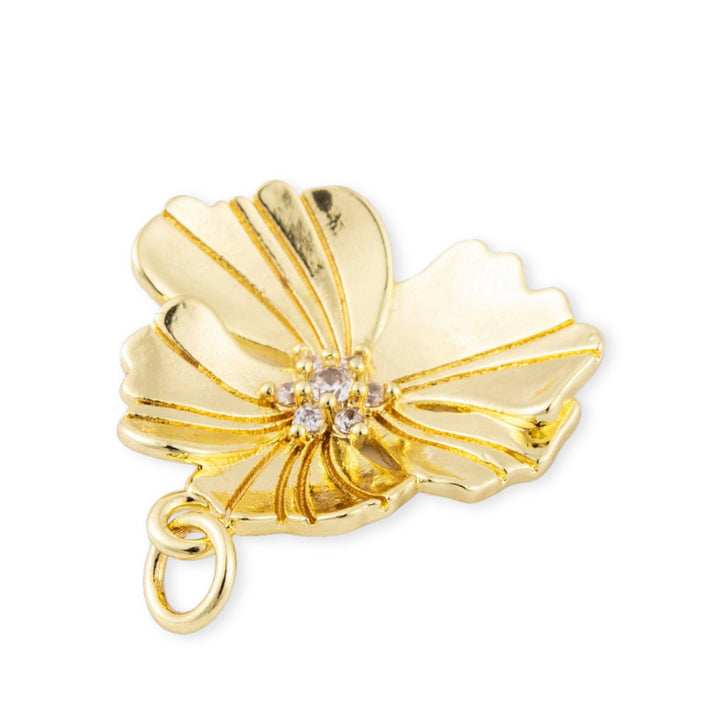 Detalles de Dije flor dorada en chapa de oro con zirconia en el centro