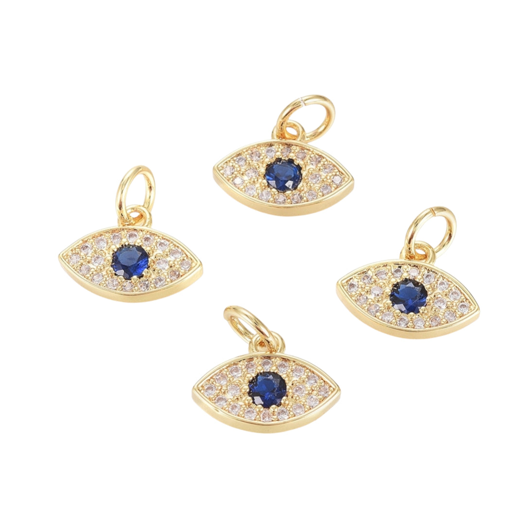 Detalles de Dije en forma de ojo dorado en chapa de oro con zirconia al centro