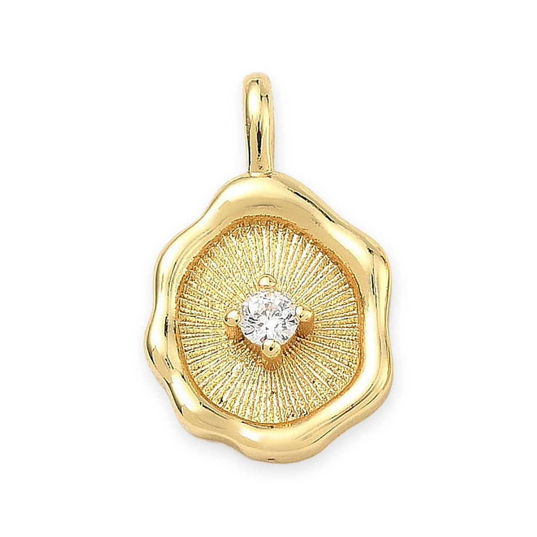 Dije dorado con zirconia, vista centrada